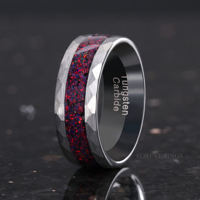 Men's 8mm hammered silver tungsten ring with black fire opal inlay, angled to show the interior