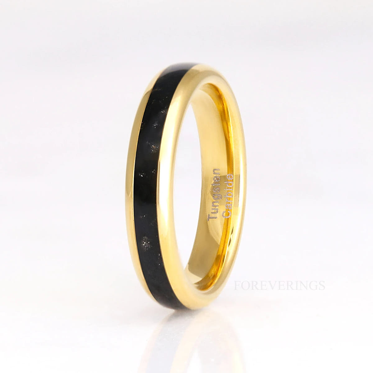 Women's 4mm gold tungsten ring with black onyx inlay standing upright