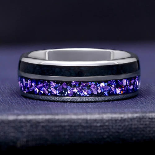 Men's 8mm silver tungsten wedding band with Crab nebula inlay of alexandrite and black onyx, lying flat
