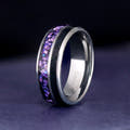 Men's 8mm silver tungsten band with crushed alexandrite and black onyx inlay, standing at an angle