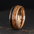 Men's 8mm rose gold tungsten band with whiskey barrel wood and coffee grind inlay, standing upright