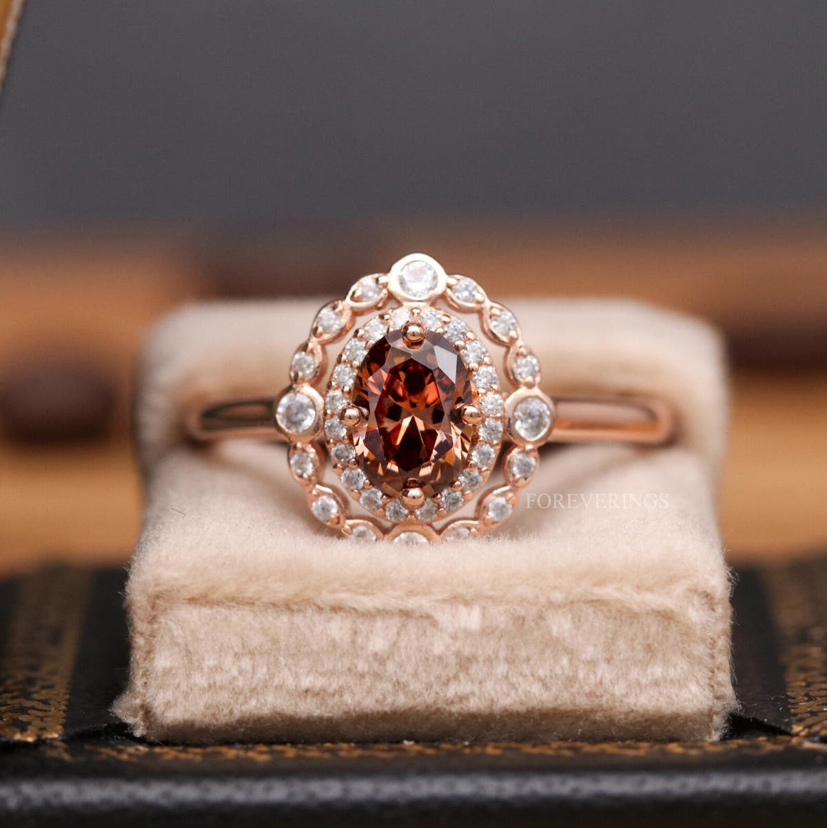Women's rose gold sterling silver oval smoky quartz engagement ring in a velvet ring box