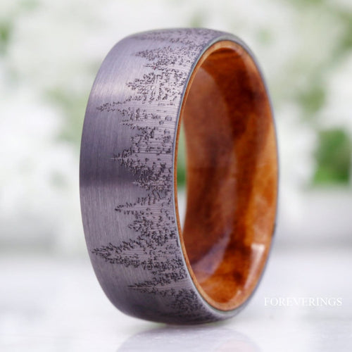 Men's 8mm silver tungsten band with an engraved forest tree-line and olive wood lining