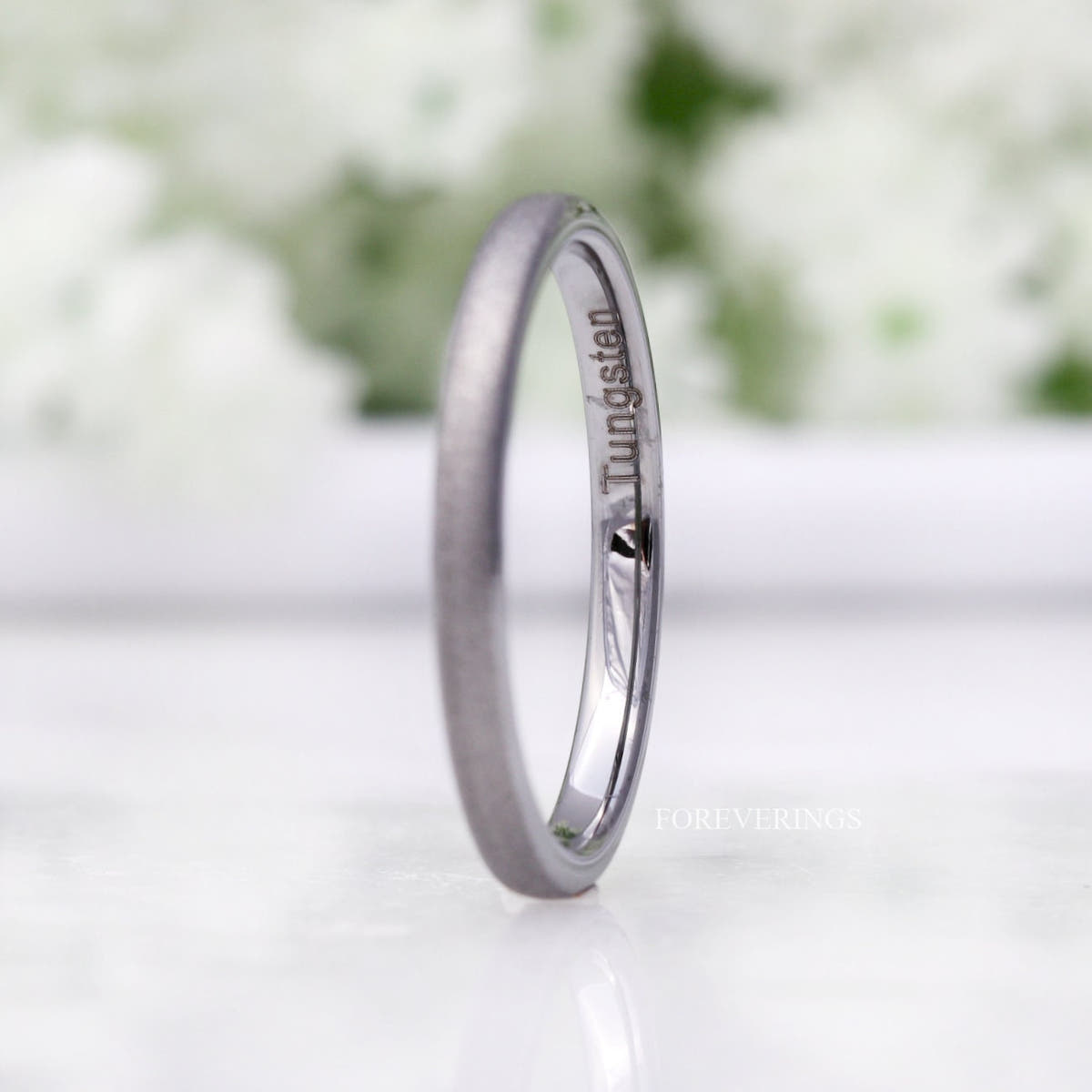 2mm sandblasted silver tungsten band angled to show the polished interior