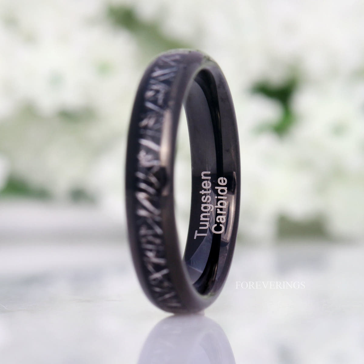 4mm black tungsten meteorite-look band turned to show the polished black interior