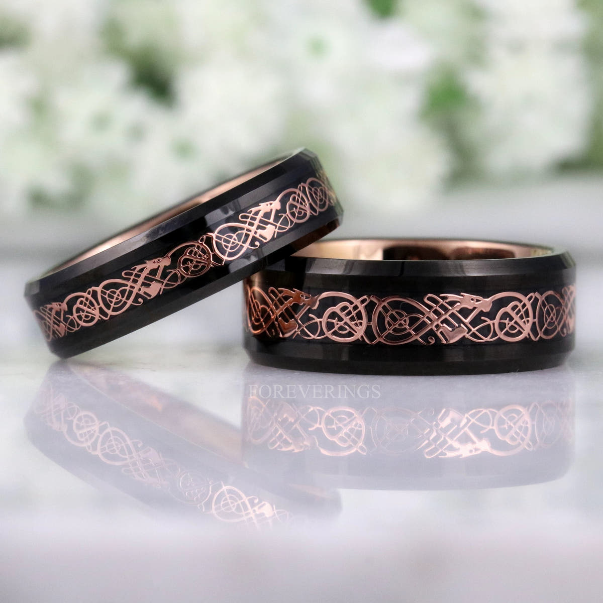 Black and rose gold dragon pattern tungsten bands in two widths, 8mm and 6mm