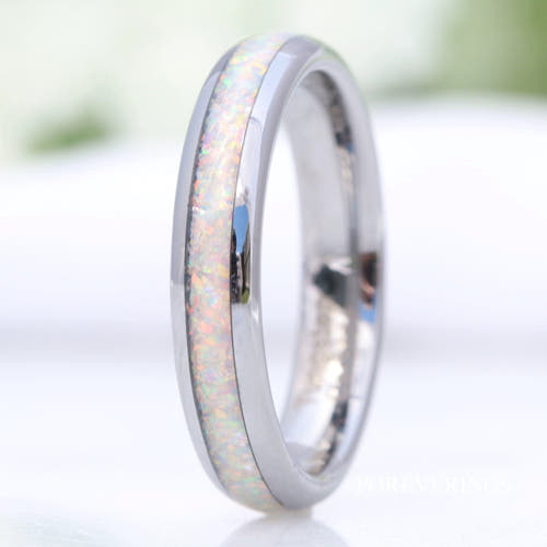 Women's 4mm silver tungsten ring with crushed white fire opal inlay, standing upright
