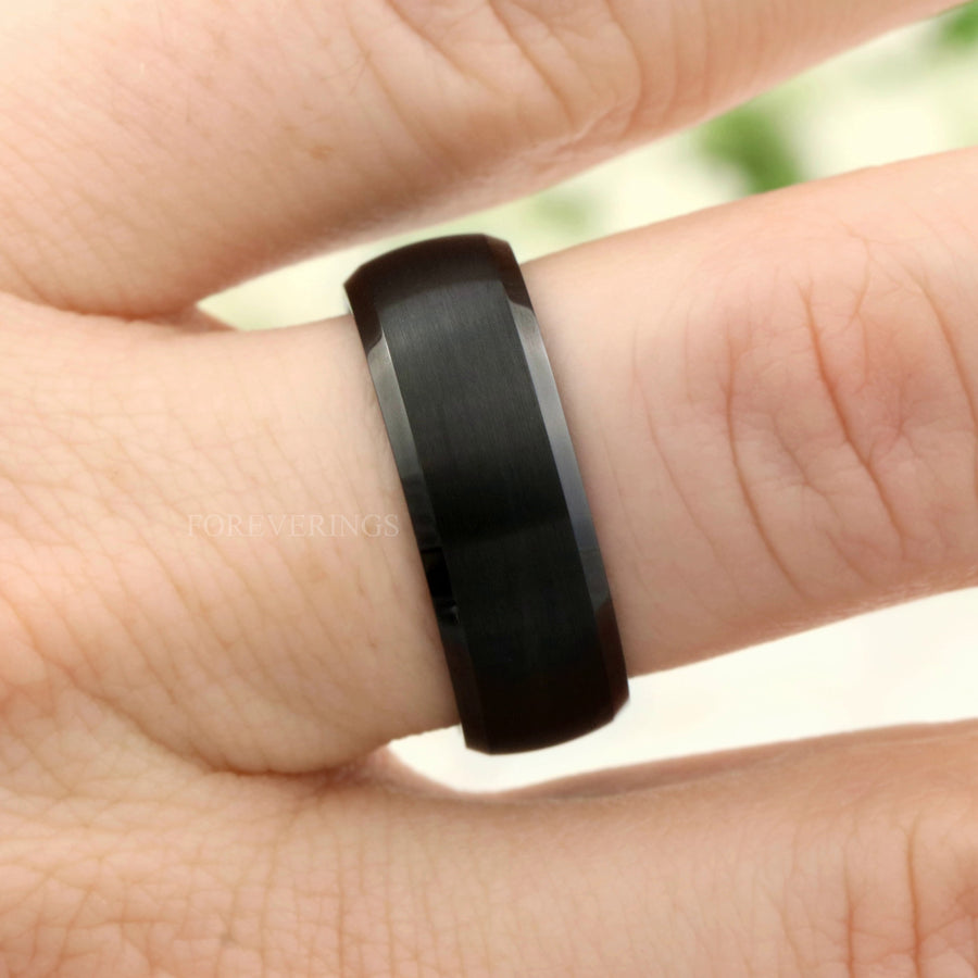 8mm brushed black tungsten wenge wood band worn on a finger