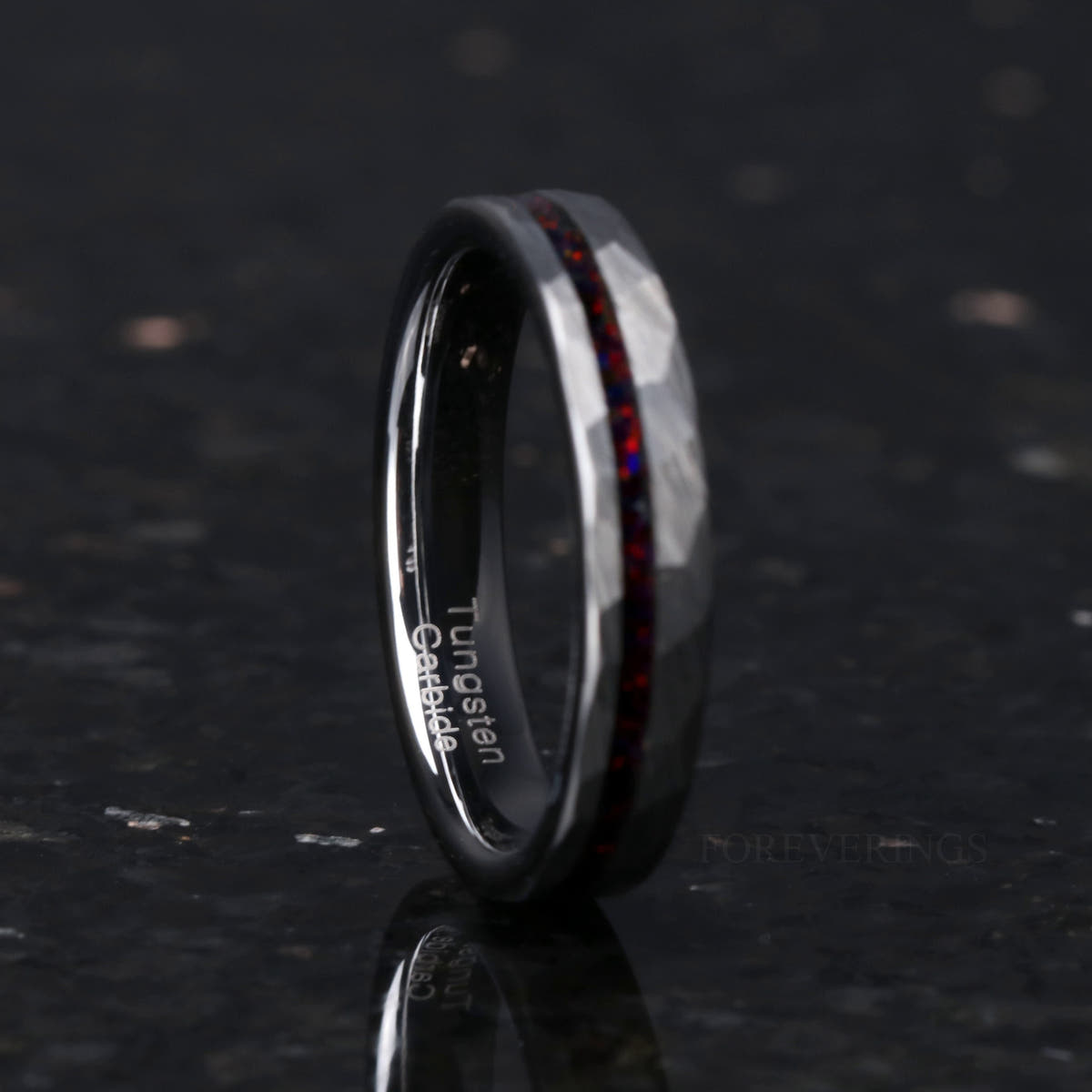 4mm hammered silver tungsten ring with a black fire opal strip, turned to show the interior