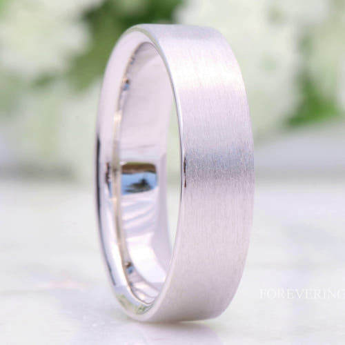 6mm brushed sterling silver wedding band, flat profile, standing close-up