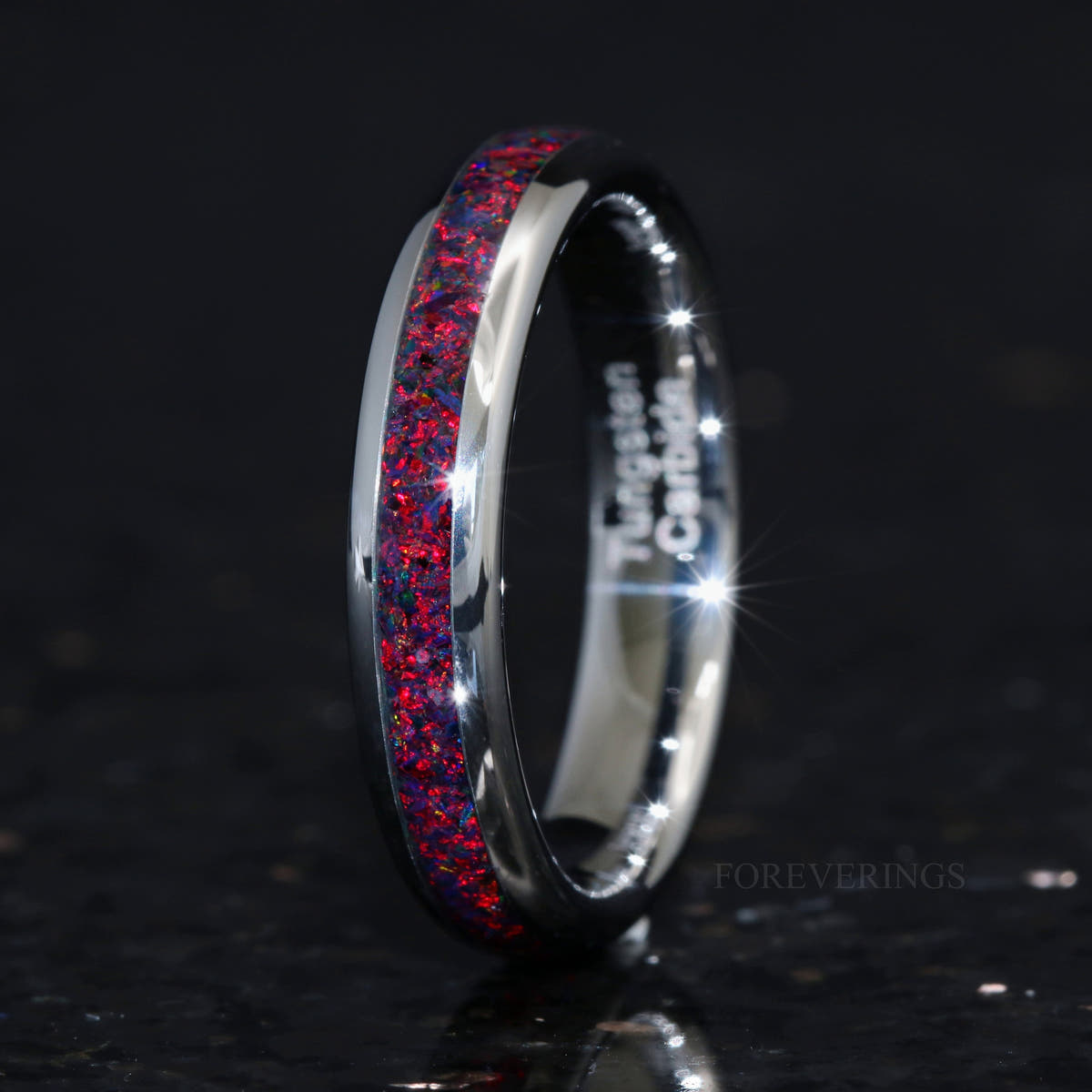 4mm silver tungsten black fire opal ring standing upright, interior visible