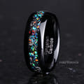 Men's 8mm polished black tungsten band with meteorite and galaxy opal inlay, standing on edge
