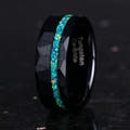 Men's 8mm hammered black tungsten ring with green opal inlay, angled to show the interior