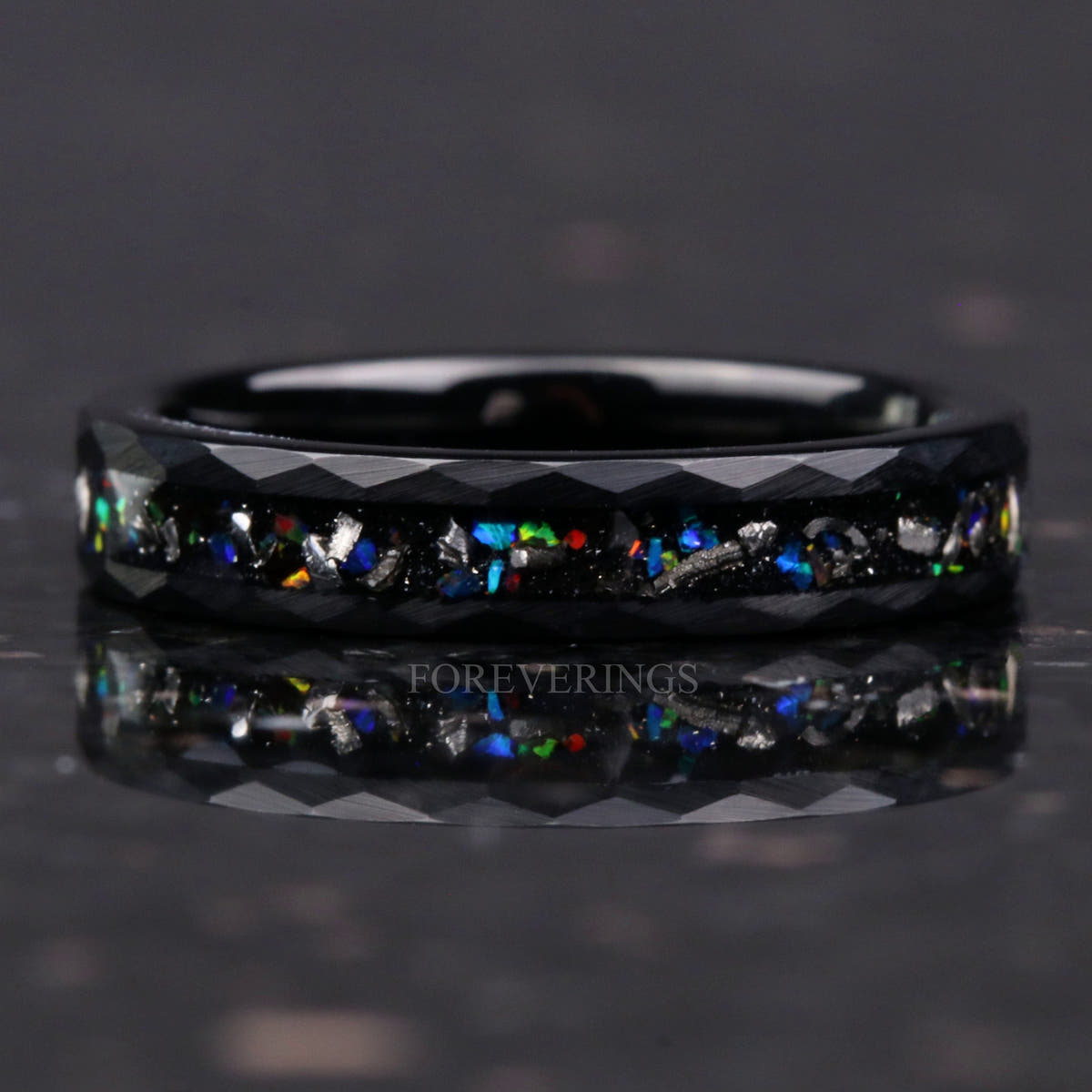 4mm hammered black tungsten band lying flat, meteorite and galaxy opal inlay with reflection below