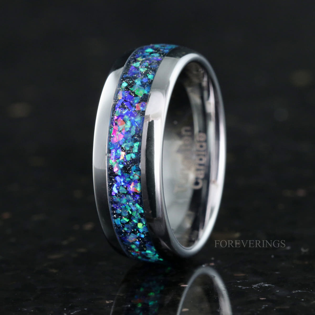 Men's 8mm polished silver tungsten ring with galaxy opal inlay, standing at an angle