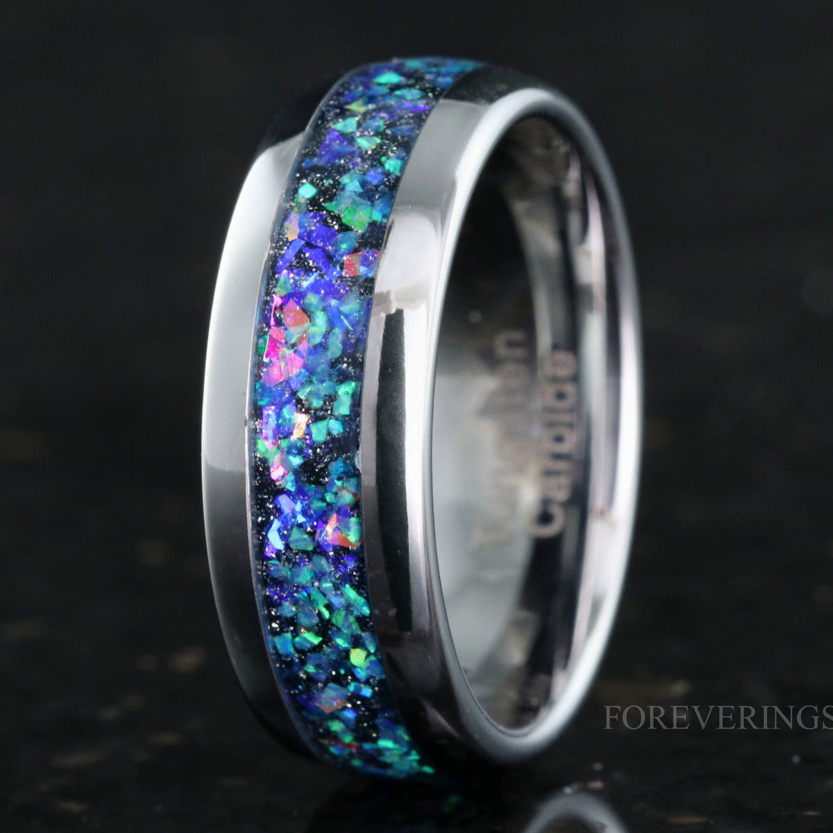 Men's 8mm silver tungsten ring with galaxy opal inlay, angled to show the polished interior