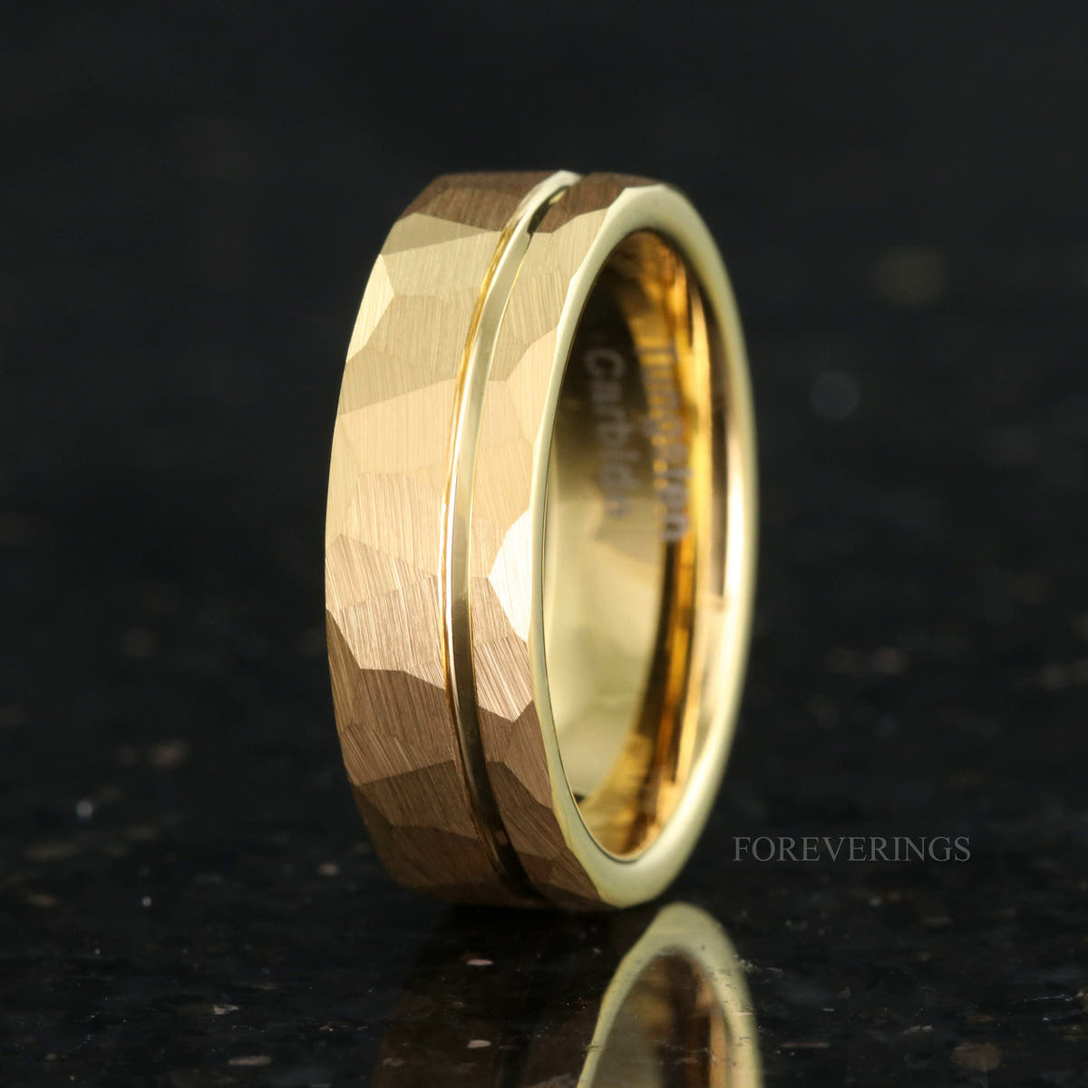 Men's 7mm hammered gold tungsten band with an offset groove, standing at an angle