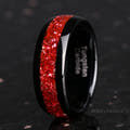 Men's 8mm black tungsten band with crushed ruby inlay, standing at an angle
