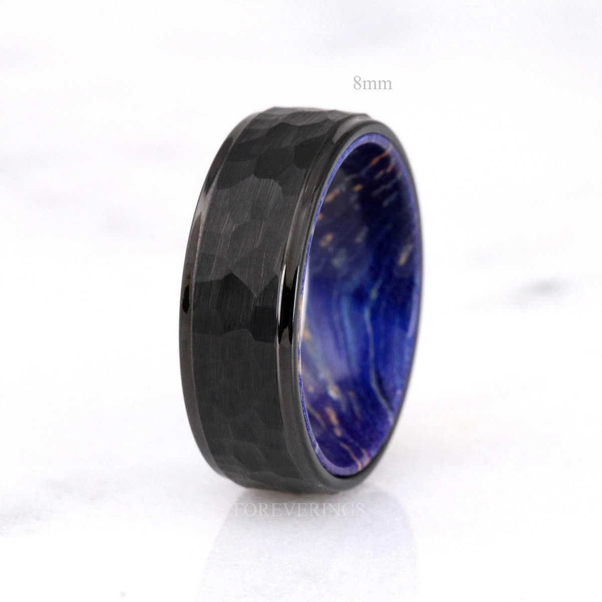 8mm hammered black tungsten wedding band with blue elder wood inside, labeled 8mm