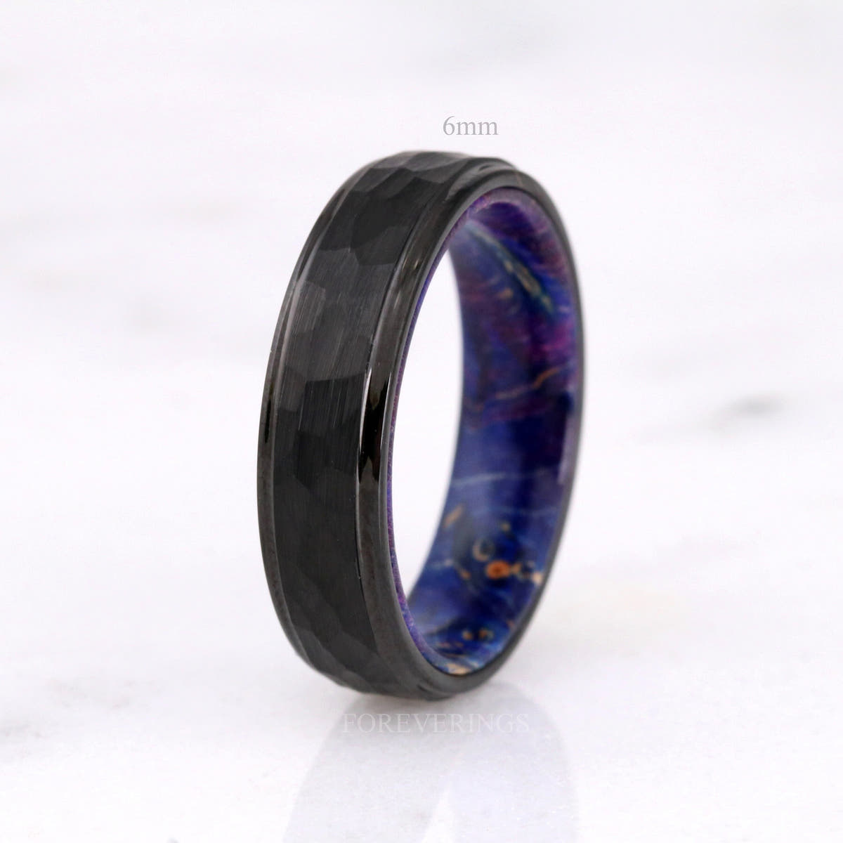 6mm hammered black tungsten band with blue elder wood inside, labeled 6mm
