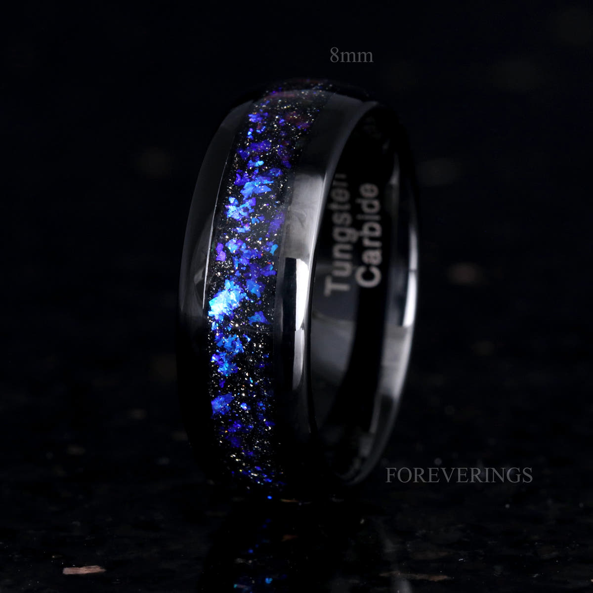 8mm black tungsten band with Orion nebula sandstone inlay, standing at an angle
