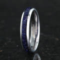 Women's 4mm silver tungsten band with blue sandstone inlay, standing upright