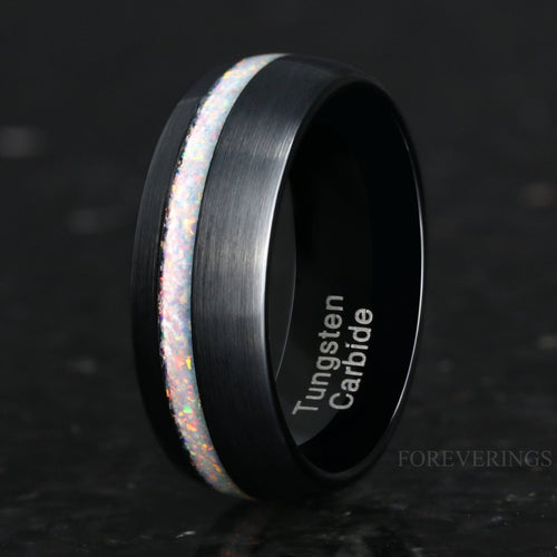 Men's 8mm brushed black tungsten ring with white fire opal inlay, angled close-up
