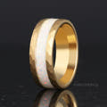 Men's 8mm hammered gold tungsten ring with crushed white fire opal inlay, standing at an angle