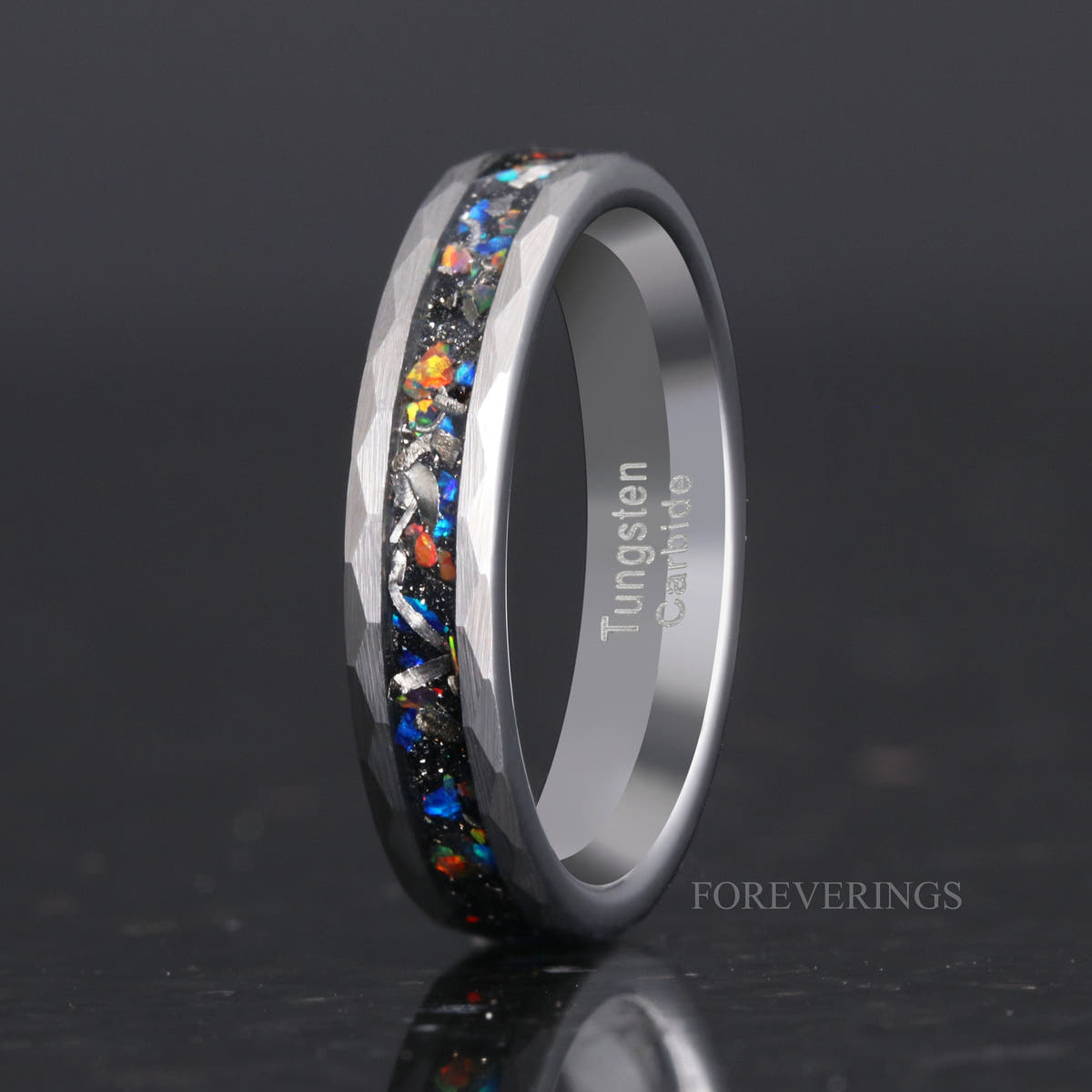Women's 4mm hammered silver tungsten ring with meteorite and galaxy opal inlay, standing upright