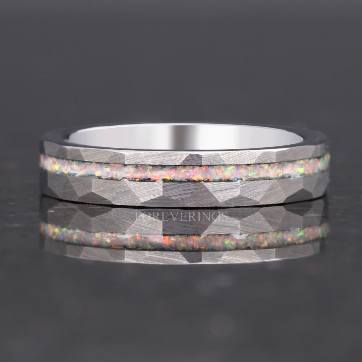 4mm hammered silver tungsten ring with an offset white fire opal strip, shown straight on