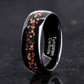 His 8mm black tungsten ring with red goldstone inlay, angled to show the interior