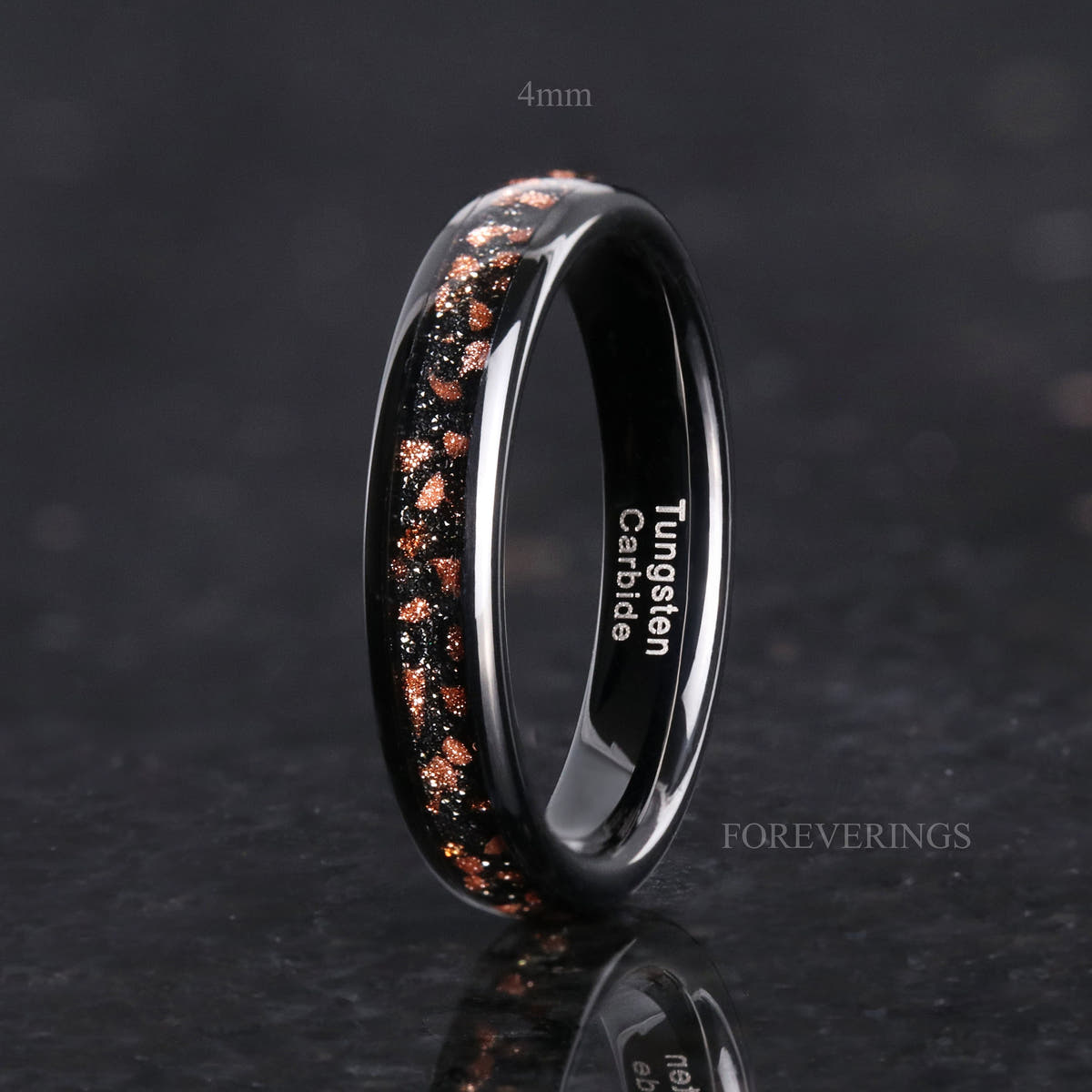 4mm black tungsten ring with red goldstone inlay standing upright, labeled 4mm