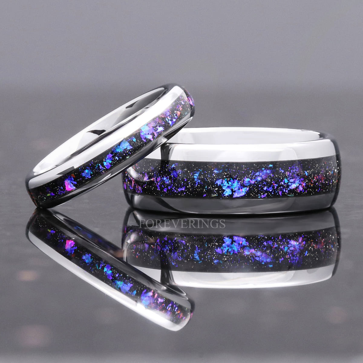 Narrow and wide silver tungsten nebula sandstone bands leaning together, wider view