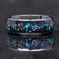 Men's 8mm black ceramic ring with galaxy opal inlay lying flat, close front view
