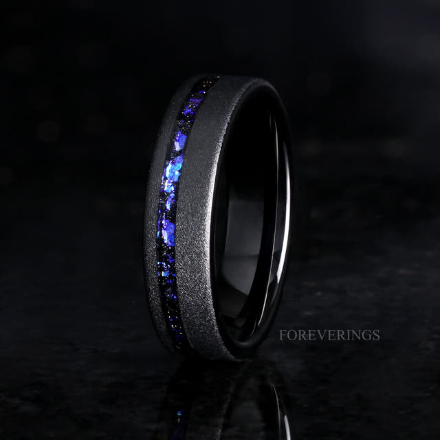 Men's 6mm sandblasted black tungsten band with nebula sandstone inlay, standing at an angle
