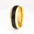 Men's 8mm gold tungsten ring with black onyx inlay, standing upright