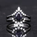 Women's black sterling silver blue sandstone bridal set with a crown halo band, front view