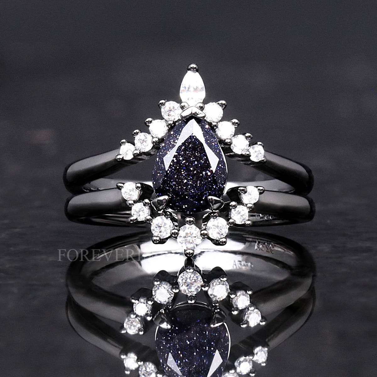 Women's black sterling silver blue sandstone bridal set with a crown halo band, front view