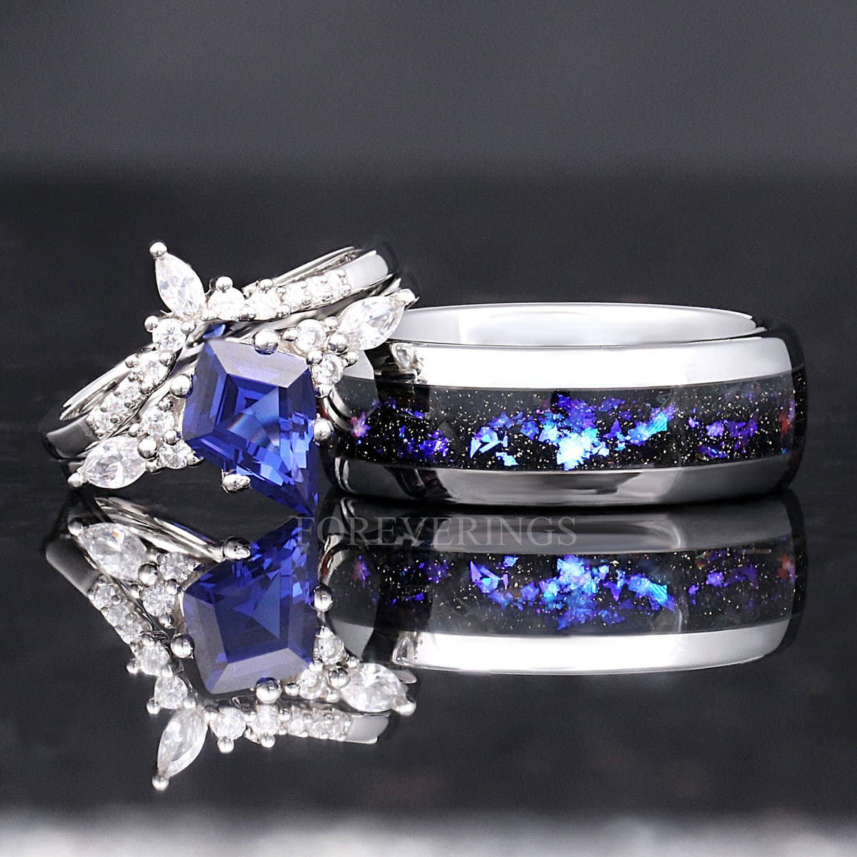 Kite-cut sapphire bridal set beside a wider silver band with Orion nebula inlay
