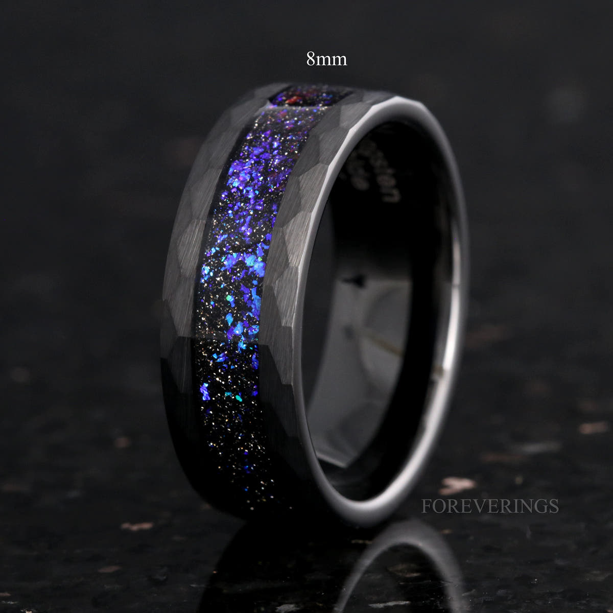 Men's hammered black tungsten band with blue nebula sandstone inlay, labeled 8mm, interior visible