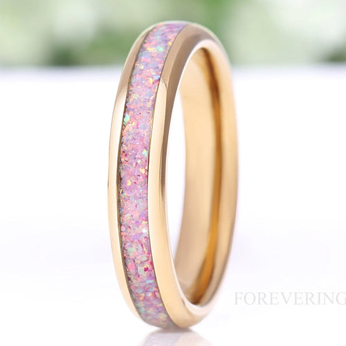 Women's 4mm gold tungsten ring with unicorn fire opal inlay, standing upright close-up