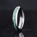 Women's 4mm silver tungsten moss agate ring angled to show the interior