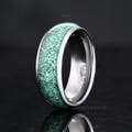 Men's 8mm silver tungsten ring with crushed green moss agate inlay, angled to show the interior