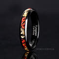 Women's 4mm black tungsten ring with red fire opal and gold leaf inlay, standing on edge