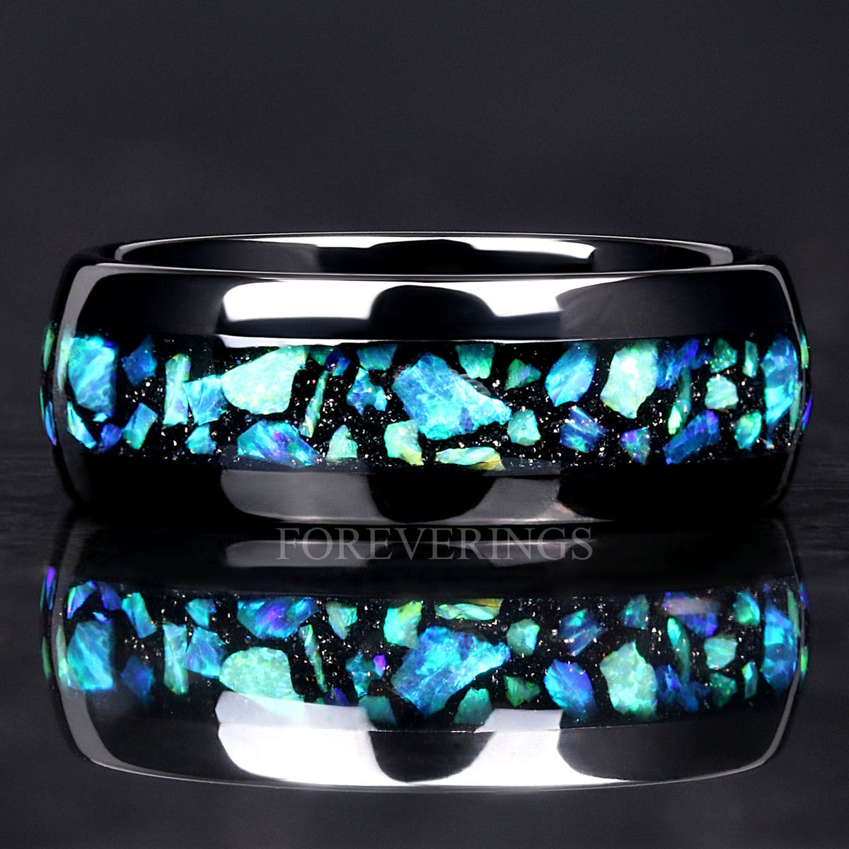 Men's 8mm black tungsten ring with blue-green opal inlay, straight on in a close crop