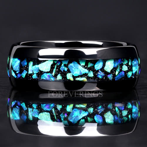 Men's 8mm black tungsten ring with blue-green opal inlay, straight on in a close crop