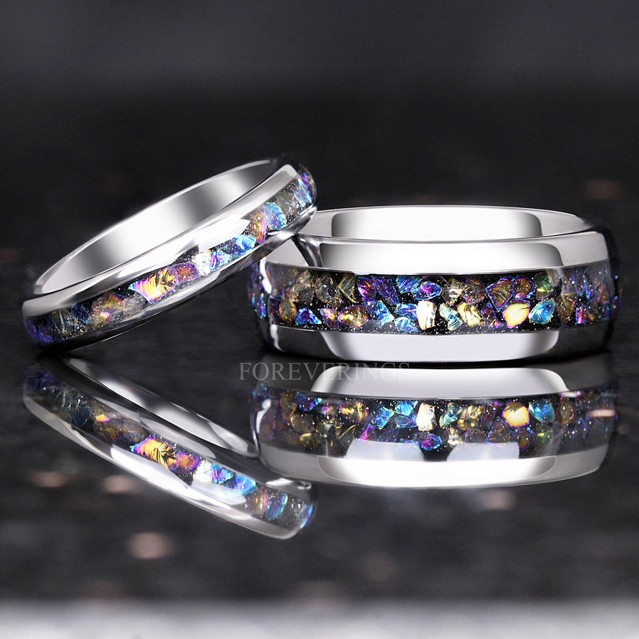 4mm silver tungsten moonstone ring leaning on a wider moonstone ring