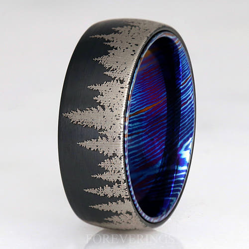 Men's 8mm black tungsten forest tree-line band with a blue Timascus interior