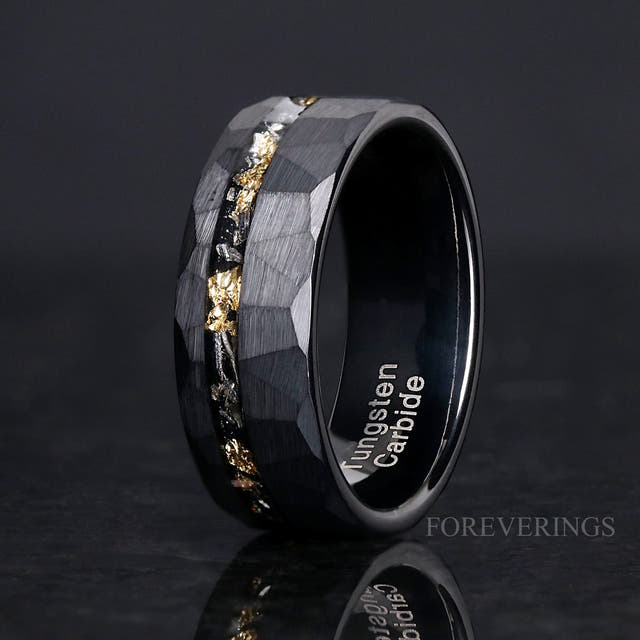 8mm hammered black tungsten band with meteorite and gold leaf inlay, angled to show the interior