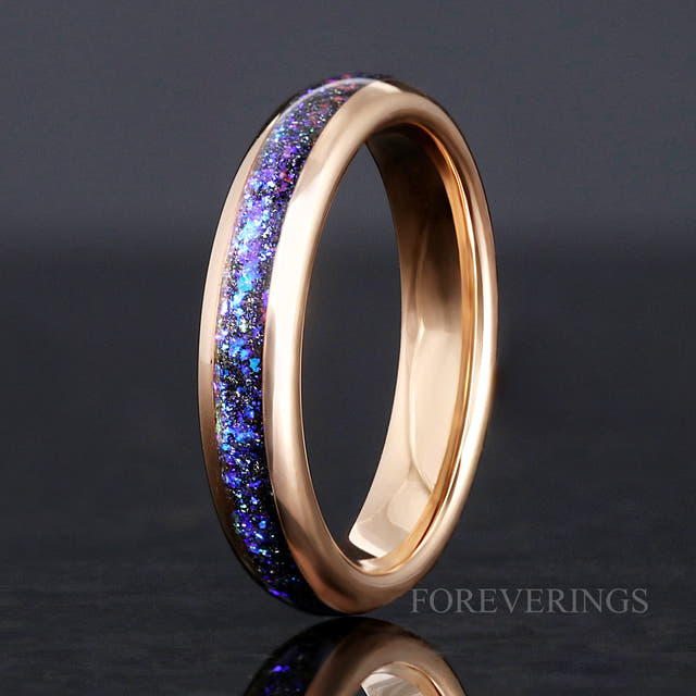 4mm rose gold tungsten Orion nebula ring standing on edge, angled to show the polished rose gold interior